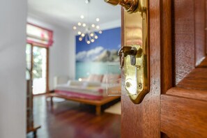 A wooden door with a brass handle and a glass panel. - Beachfront Ground-Floor Villa w/ Pool & BBQ (Playa Honda)