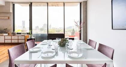 Loft in fifth floor with great views to green and the city and a roof garden too