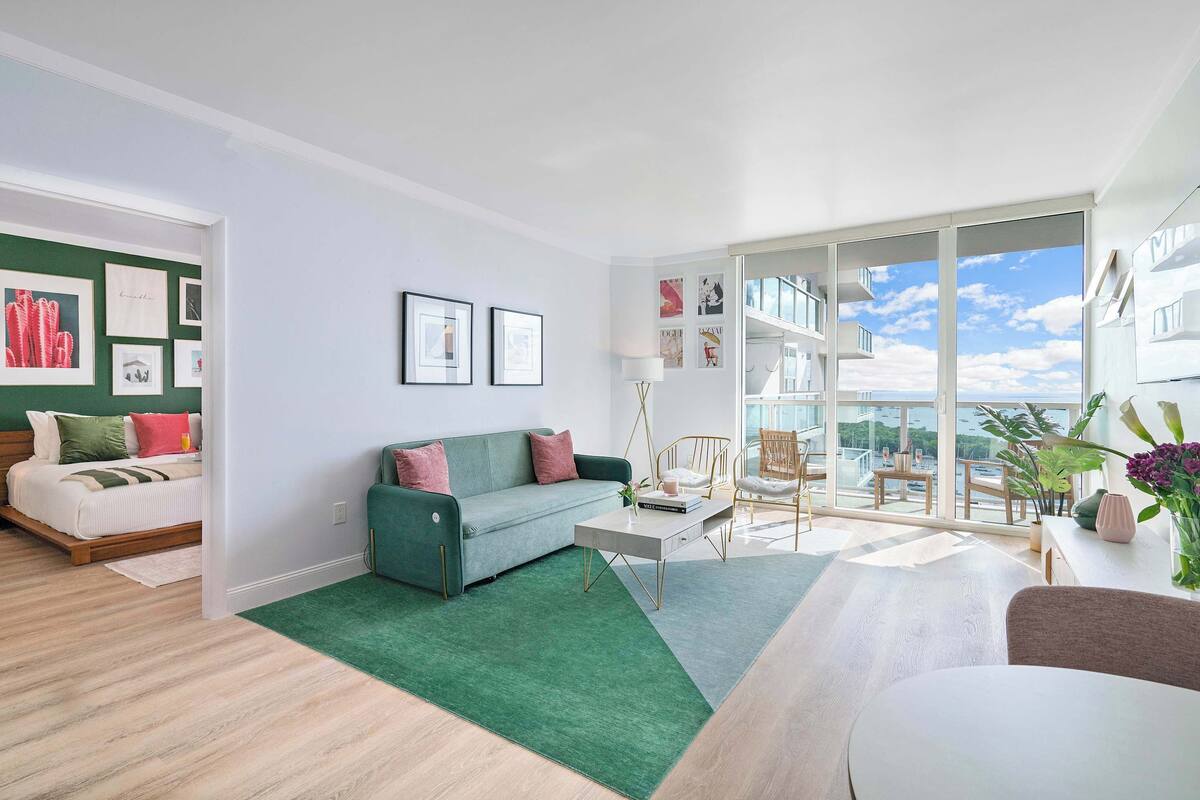 Deluxe Apartment, Balcony, Partial Ocean View | Living area | 49-inch LED TV with cable channels, TV