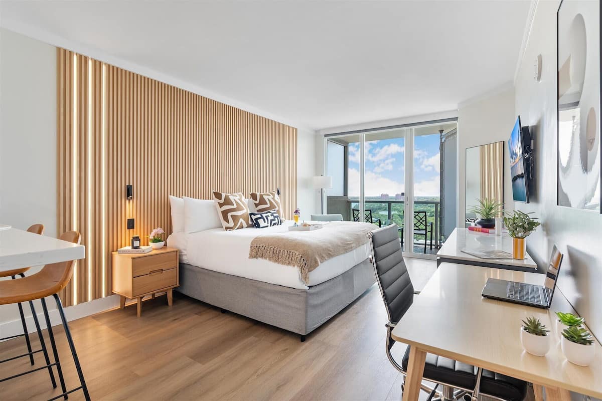Deluxe Studio, Pool View | Premium bedding, in-room safe, desk, laptop workspace