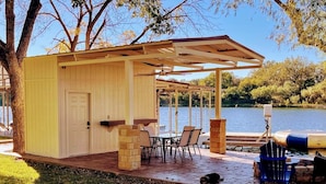 Outdoor dining - Open Water Luxury LBJ House with Heated Pool and Lakeside Pavilion! Sleeps 17 (Burnet)