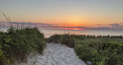 Pet Friendly! Water Views from roof deck. Steps to the beach and sunsets.