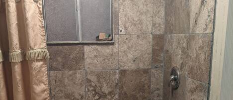 Shower, hair dryer, towels, soap