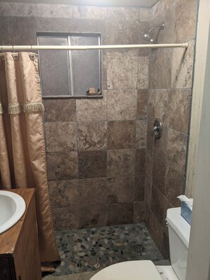 Shower, hair dryer, towels, soap