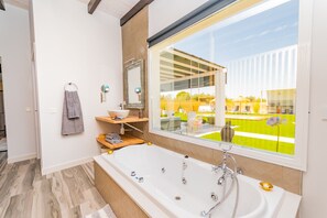 Bathtub, hair dryer, towels