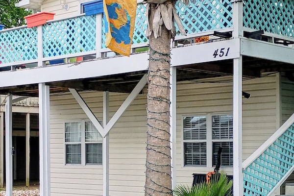 Beautifully landscaped enjoy the scenery as you pull up to your vacation home.