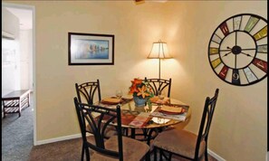 Enjoy meals with family and friends in this cozy dining area, complete with a round table and four comfortable chairs.
