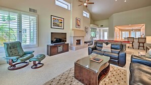 A spacious living room with a fireplace, a ceiling fan, and a pool table. - 259250 3 BR La Quinta Mtn Resort Golf Course Home (La Quinta)