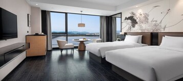 Desk, laptop workspace, blackout drapes, bed sheets