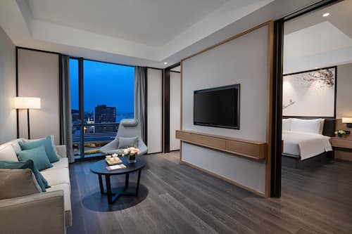 Deluxe Studio Suite, River View | Living area | Flat-screen TV