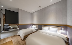 A modern hotel room with two beds, a massage chair, and a brick accent wall. - Brown Dot Hotel Wolgot (Siheung)