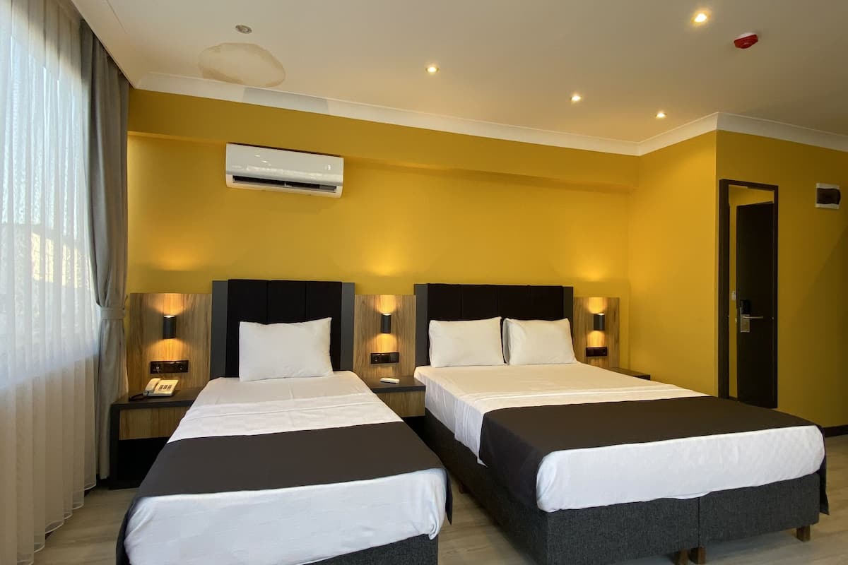 classic triple room, city view | free wifi, bed sheets