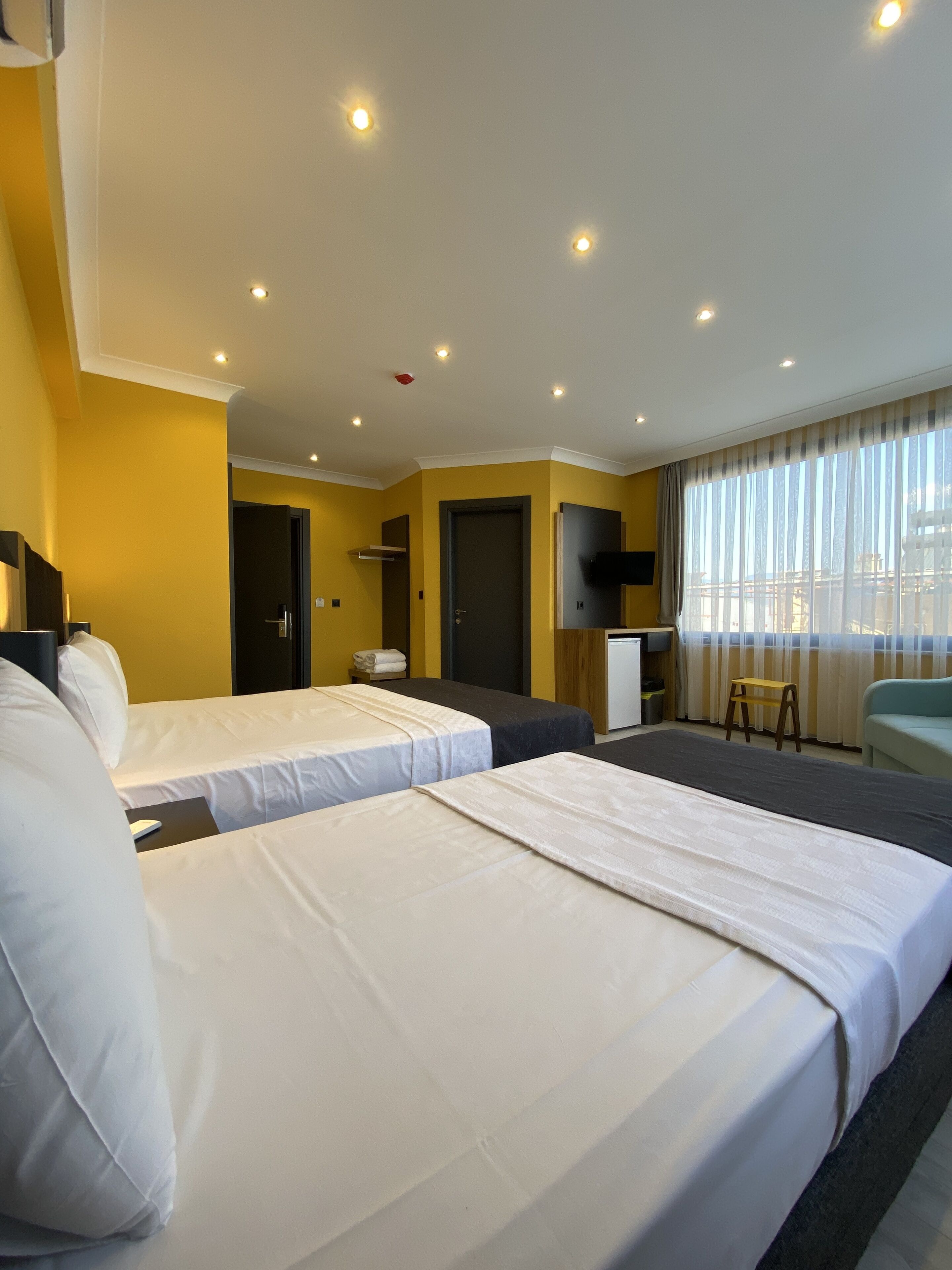 classic triple room, city view | free wifi, bed sheets