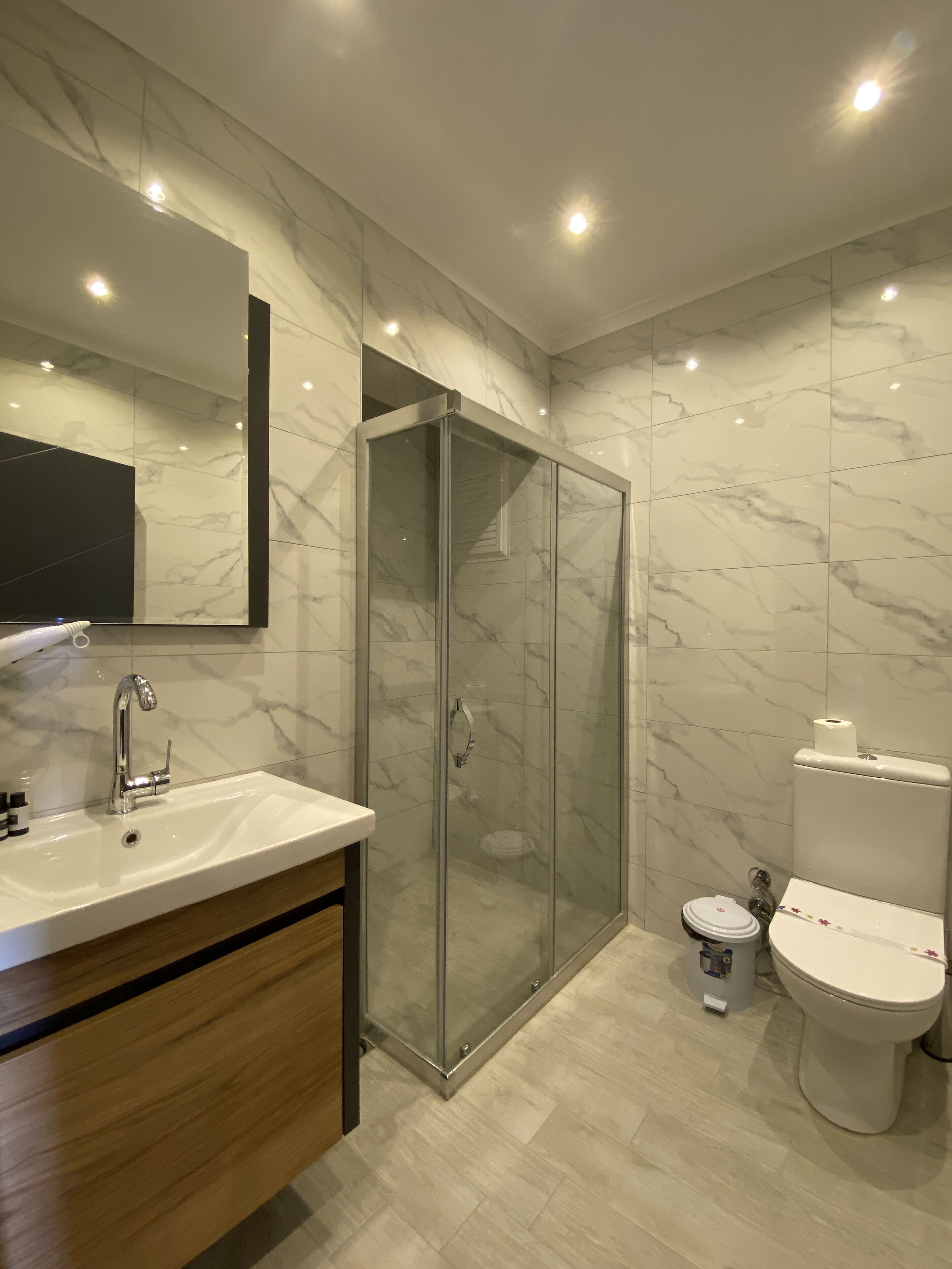 classic triple room, city view | bathroom | shower, hair dryer, towels