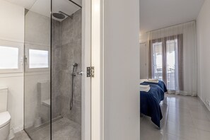 Shower, hair dryer, towels, toilet paper