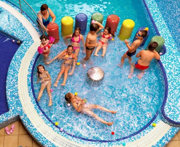 3 indoor pools, 5 outdoor pools, open 9:00 AM to 8:00 PM, pool umbrellas