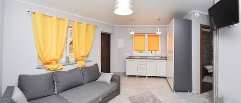 Suite monolocale Premium | Area soggiorno | TV
