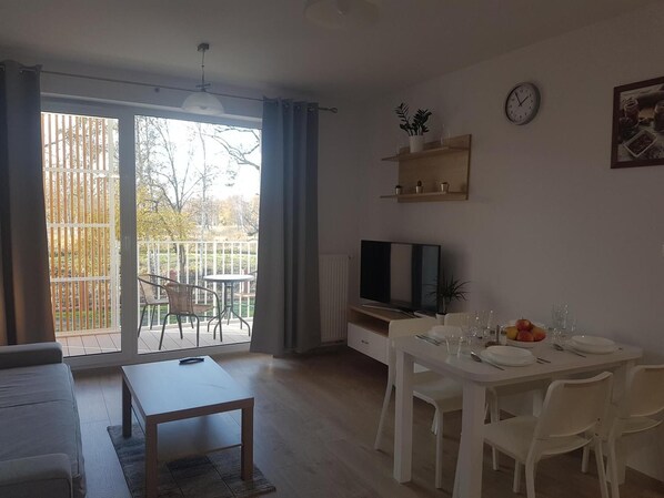 Standard Apartment | Living area | 26-inch flat-screen TV with digital channels, TV - Feniks Kolobrzeg Podczele-365PAM (Kolobrzeg)