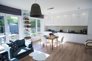 Standard Apartment | Living area | 26-inch flat-screen TV with satellite channels, TV, fireplace - Kap Ustronie Morskie - 365PAM (Ustronie Morskie)