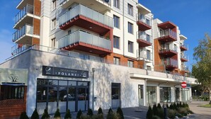 A multi-story building with a restaurant named "Polanski" on the ground floor.