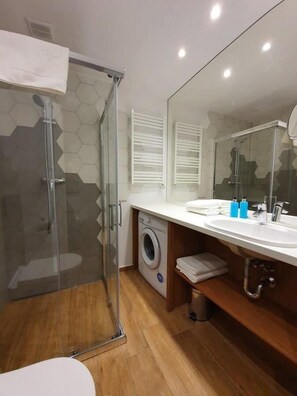 Shower, hair dryer, towels, soap
