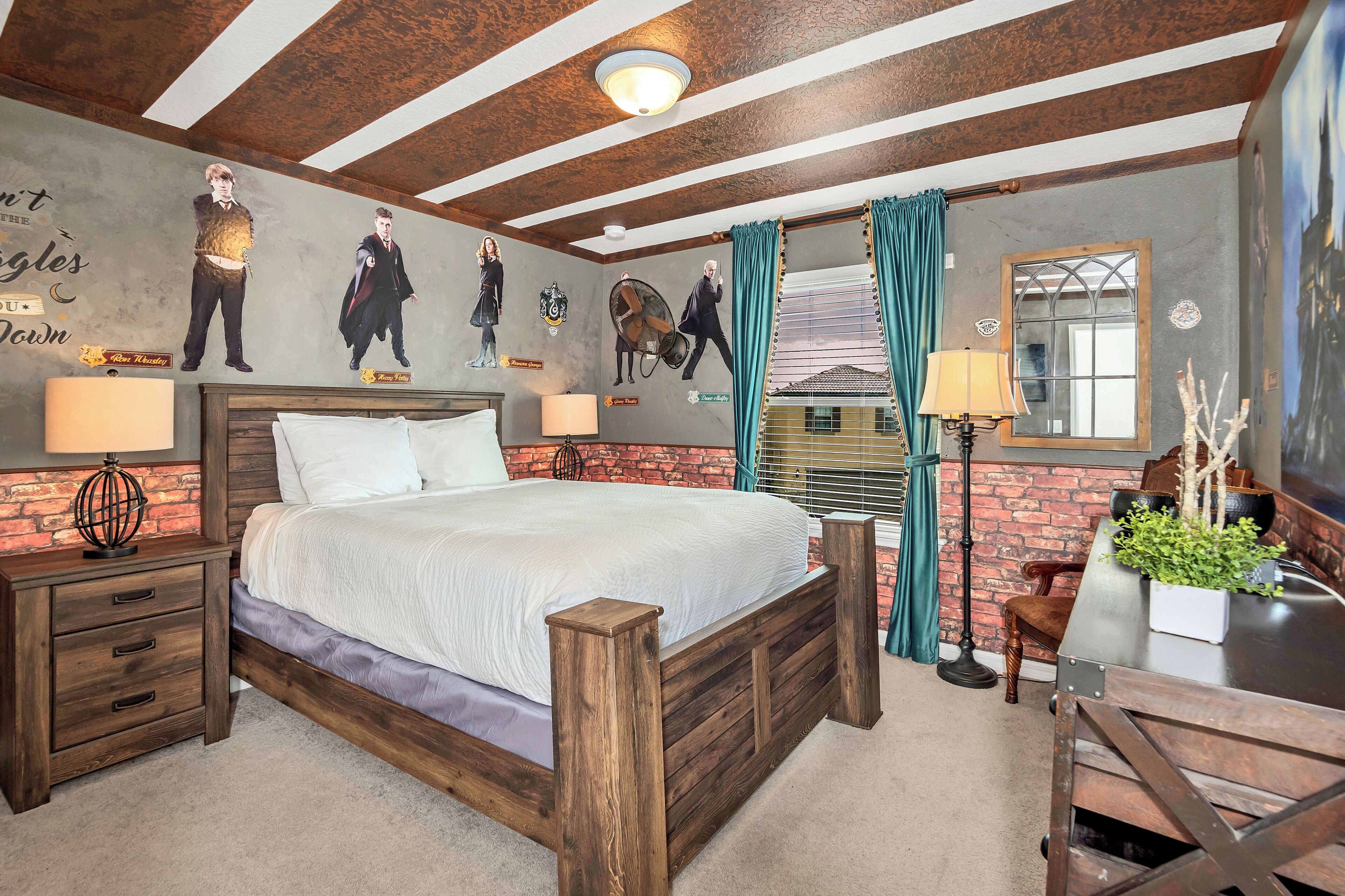 A bedroom with a wooden bed, a brick wall, and a ceiling with exposed beams.