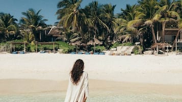 On the beach, sun loungers, beach towels