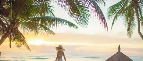 On the beach, sun loungers, beach towels