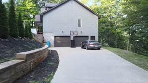 A two-story house with a garage, a driveway, and a car parked in front. - Close by downtown Asheville, the Biltmore Estate, Blue Ridge ParkWay, Arboretum. (Candler)