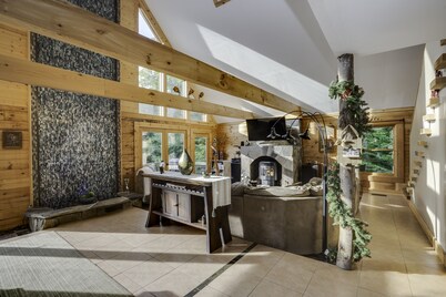 Secluded modern log cabin with picturesque private water fall on 12 acres!