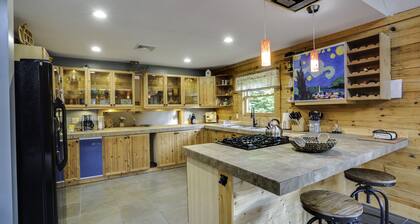 Secluded modern log cabin with picturesque private water fall on 12 acres!