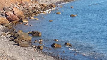 On the beach, sun-loungers, beach towels