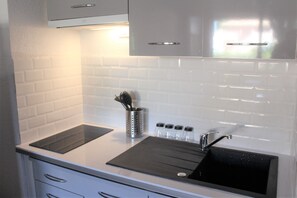 Fridge, microwave, stovetop, coffee/tea maker