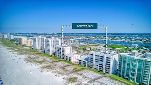 A coastal hotel with multiple high-rise buildings, a beach, and a marina. - Shipwatch 102A by Liquid Life (Pensacola)