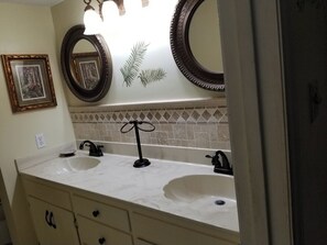 Hair dryer, towels, shampoo, toilet paper