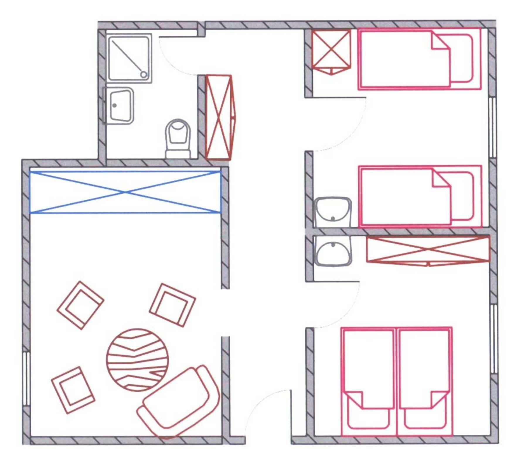 A hotel layout with multiple rooms, a central area with a seating arrangement, and a staircase.