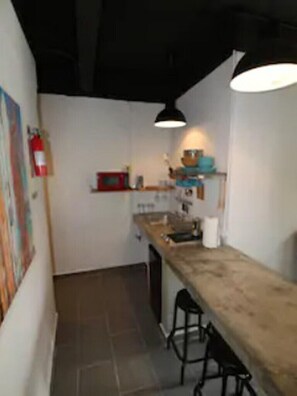 Fridge, microwave, stovetop, coffee/tea maker