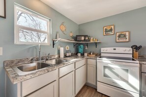 Fridge, microwave, stovetop, coffee/tea maker