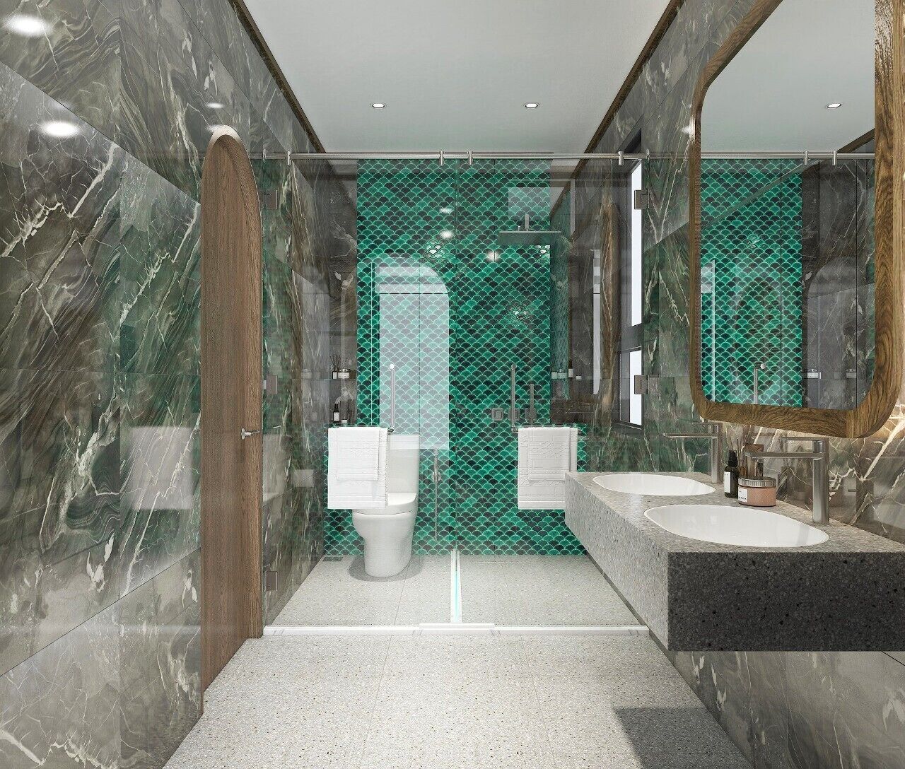 A modern bathroom with marble walls, a large mirror, two sinks, and a toilet.