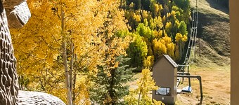 Stunning ski-in/out condo with balcony, fireplace, hot tub, & mountain views