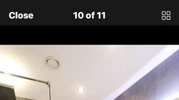 Shower, hair dryer, towels, shampoo