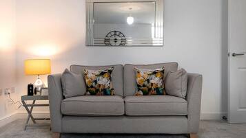 40-inch flat-screen TV with digital channels, TV, DVD player