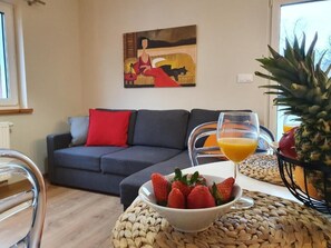 Standard Apartment | Living area | 26-inch flat-screen TV with satellite channels, TV