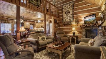 Een flatscreentelevisie, een open haard en een stereo