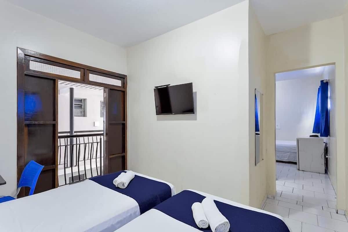 Desk, laptop workspace, free WiFi, bed sheets