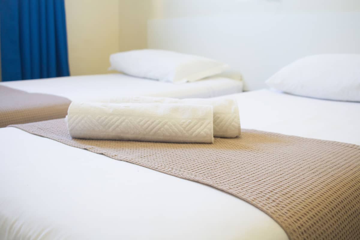 Desk, laptop workspace, free WiFi, bed sheets