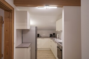 Fridge, stovetop, coffee/tea maker, toaster