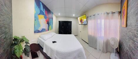 River Room | Premium bedding, down comforters, blackout drapes, soundproofing