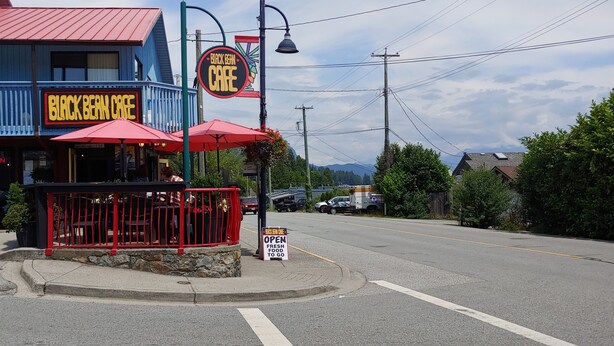 A Bluebell Cafe with outdoor seating and a sign indicating fresh food.