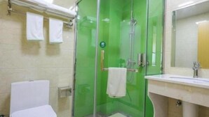 A bathroom with a glass shower enclosure, a toilet, and a sink with a mirror. - Greentree Inn Jiaxin Puyuan Kaixuan Road (Jiaxing)